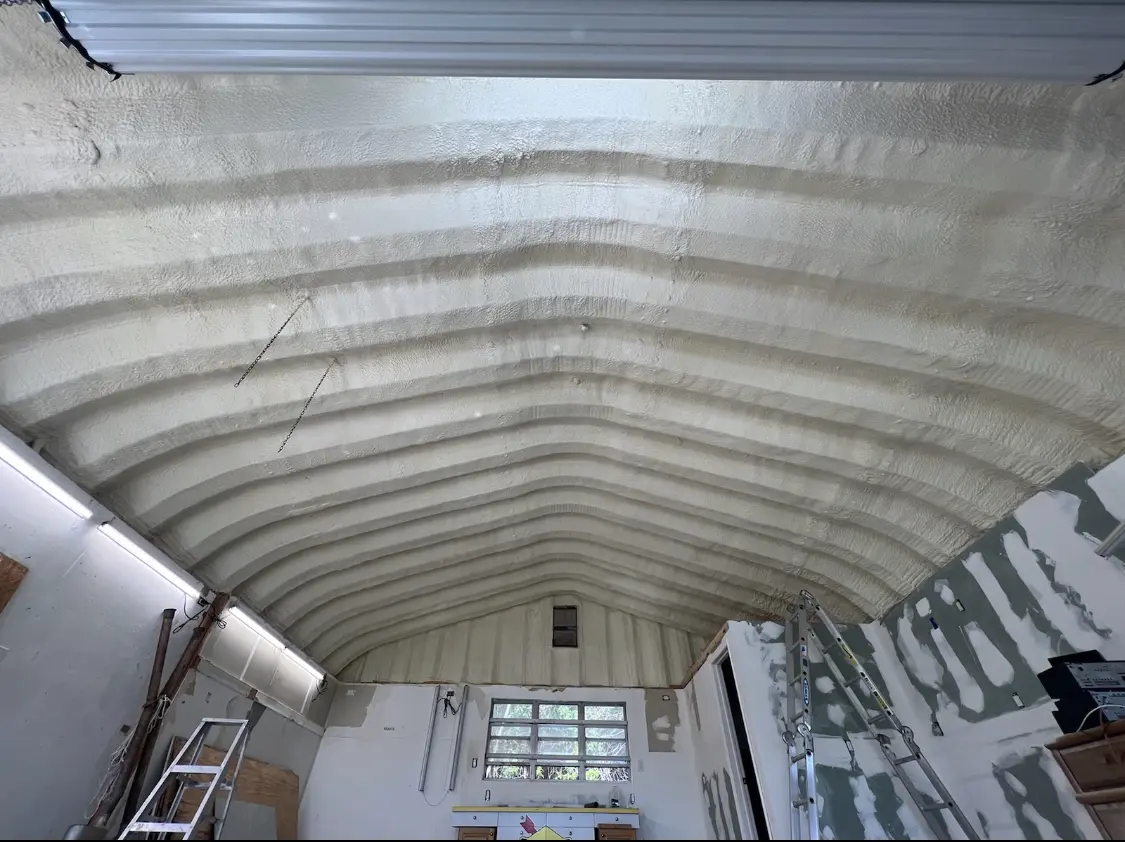 Spray polyurethane foam applied to the underside of a metal roof deck in Rossmoor
